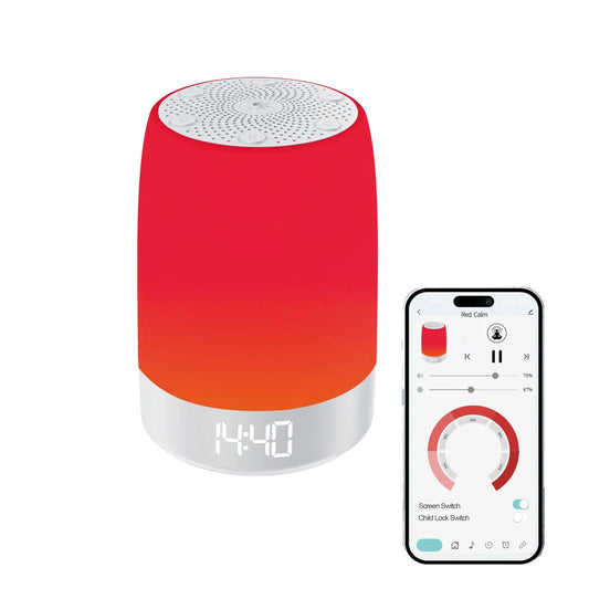 Dreamery Luma Zero white noise machine with red bedside light beside a clock on a calm bedside table
