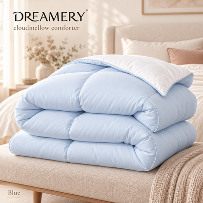 Blue Dreamery Cloudmellow comforter with a white reverse styled on a bed